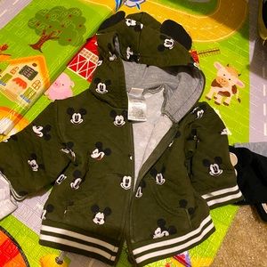 Two 3-6m jackets and one Mickey Mouse outfit